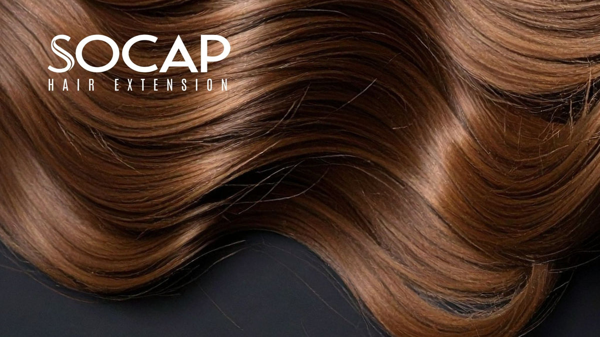 SOCAP Hair Extension Logo auf glänzendem, gewelltem braunem Echthaar